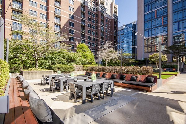 Chic outdoor patio space with modern seating at Elofts Apartments, perfect for relaxation and social gatherings