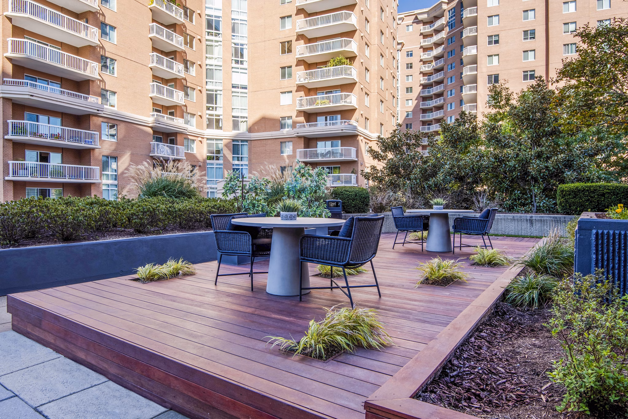 Spacious outdoor patio with modern seating at Elofts Apartments, perfect for relaxation and socializing
