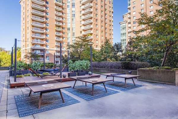 Vibrant patio area with seating and decorative lighting at Elofts Apartments