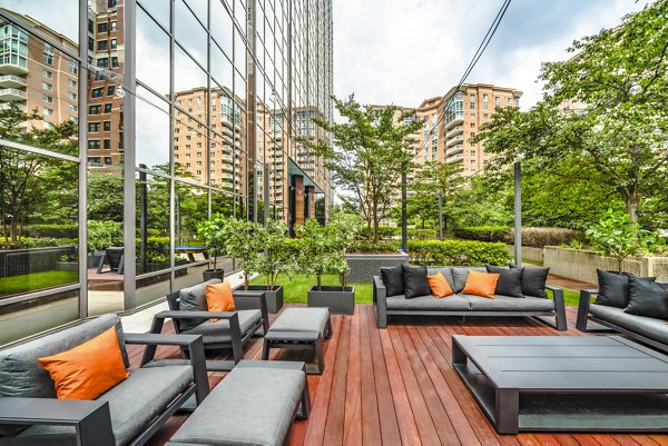 Elofts Apartments: Cozy patio with modern furniture and lush greenery for outdoor relaxation