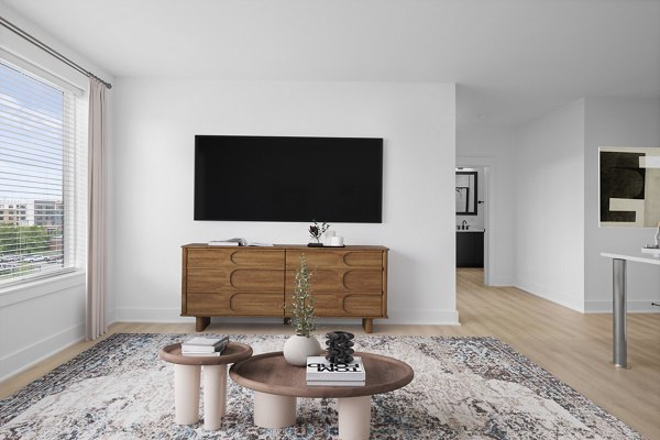 Spacious living room with modern decor at Elan LoSo Apartments