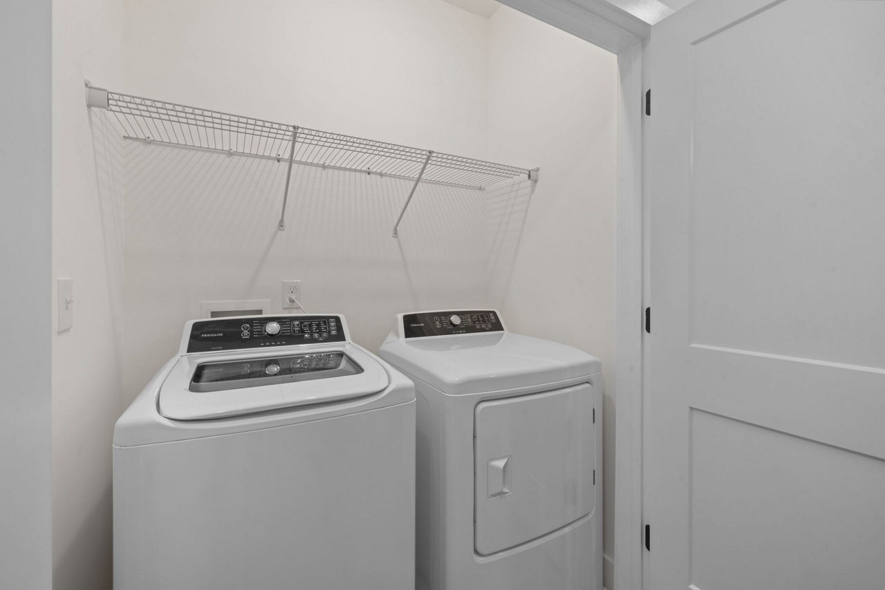 Laundry room at The Range On Oleander Apartments