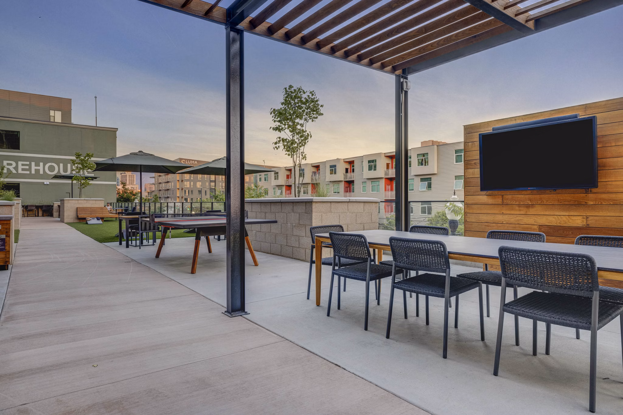Clubhouse with modern furnishings at CINQ Apartments, perfect for social gatherings and relaxation