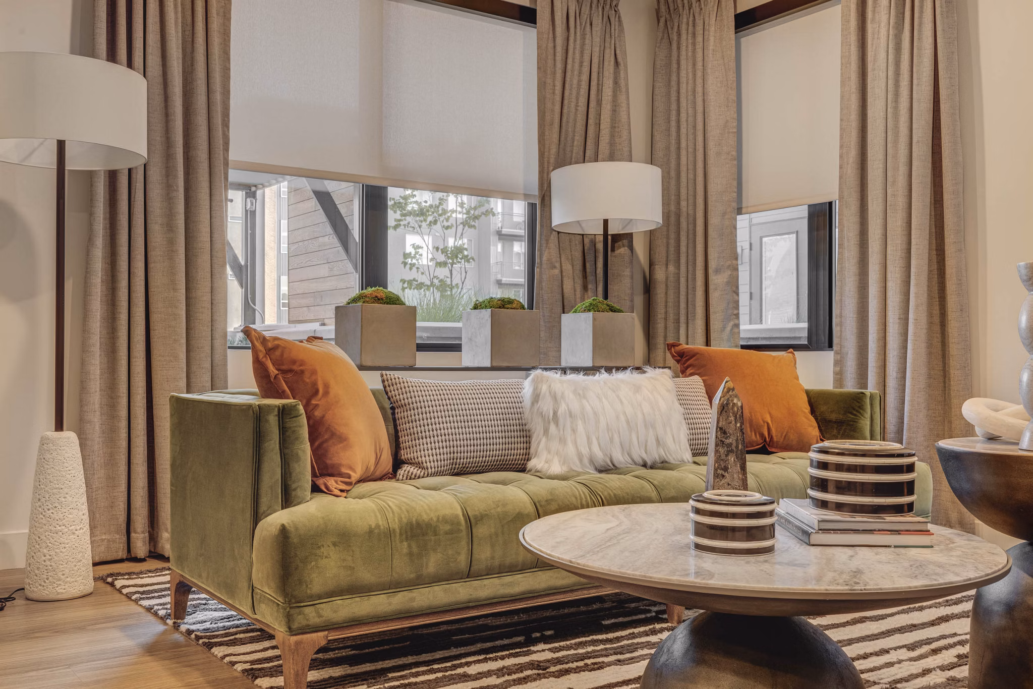 Clubhouse with modern seating and entertainment options at CINQ Apartments, ideal for social gatherings and community events