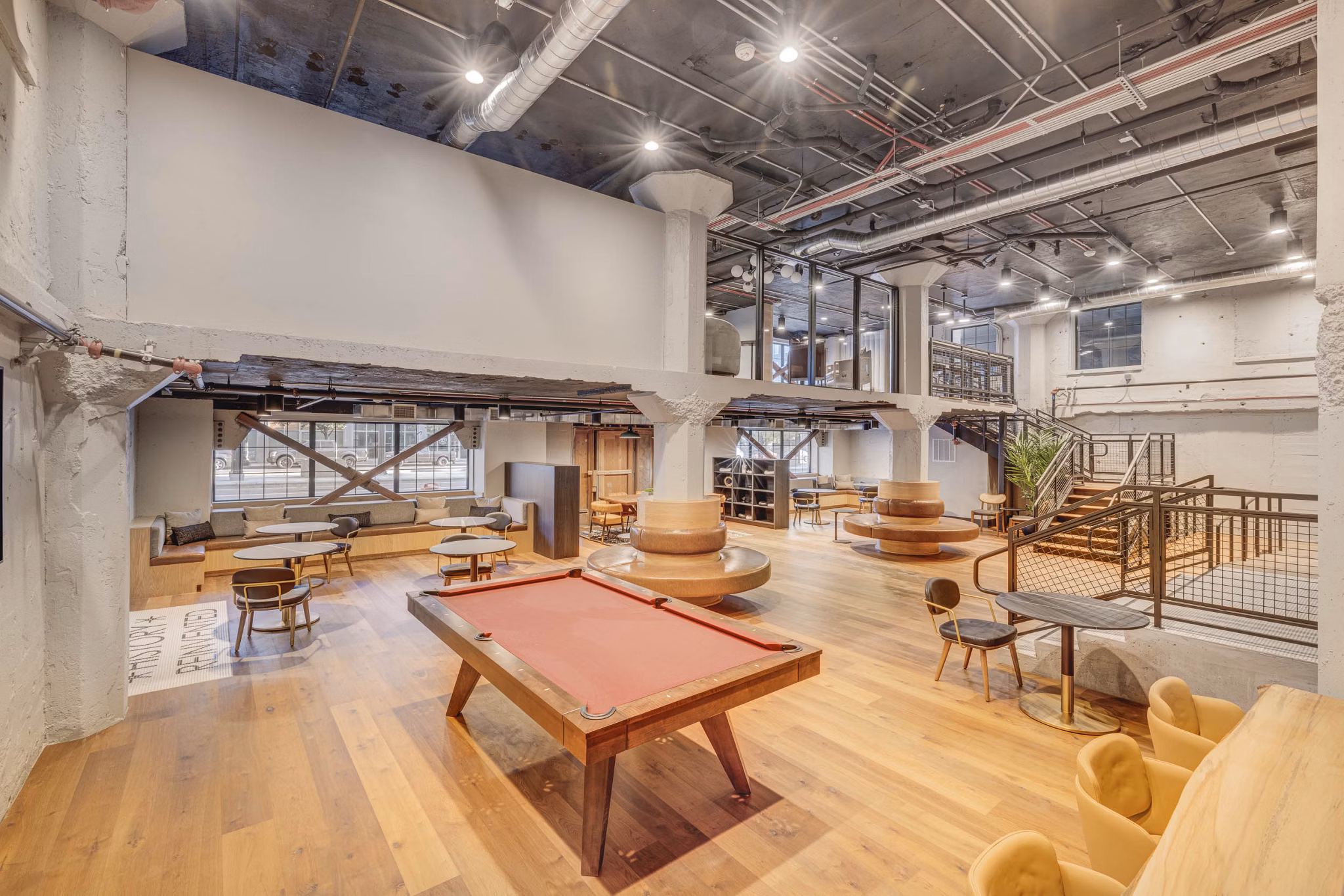 Luxurious clubhouse with stylish seating and modern decor at CINQ Apartments, perfect for social gatherings and relaxation