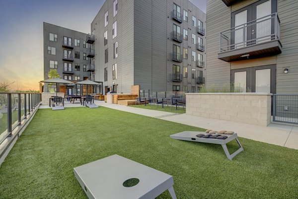 Playground with modern equipment at CINQ Apartments