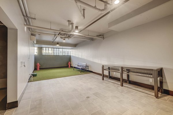 Game room featuring billiards and lounge area at CINQ Apartments