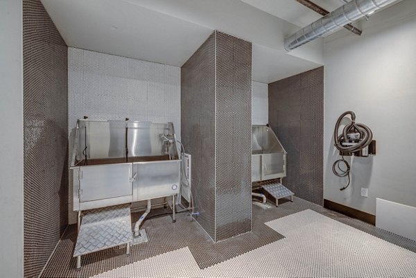 Dog wash station at CINQ Apartments offering pet-friendly amenities for luxury living