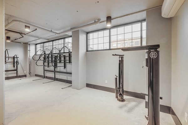 Secure bike storage facility at CINQ Apartments with easy access for residents