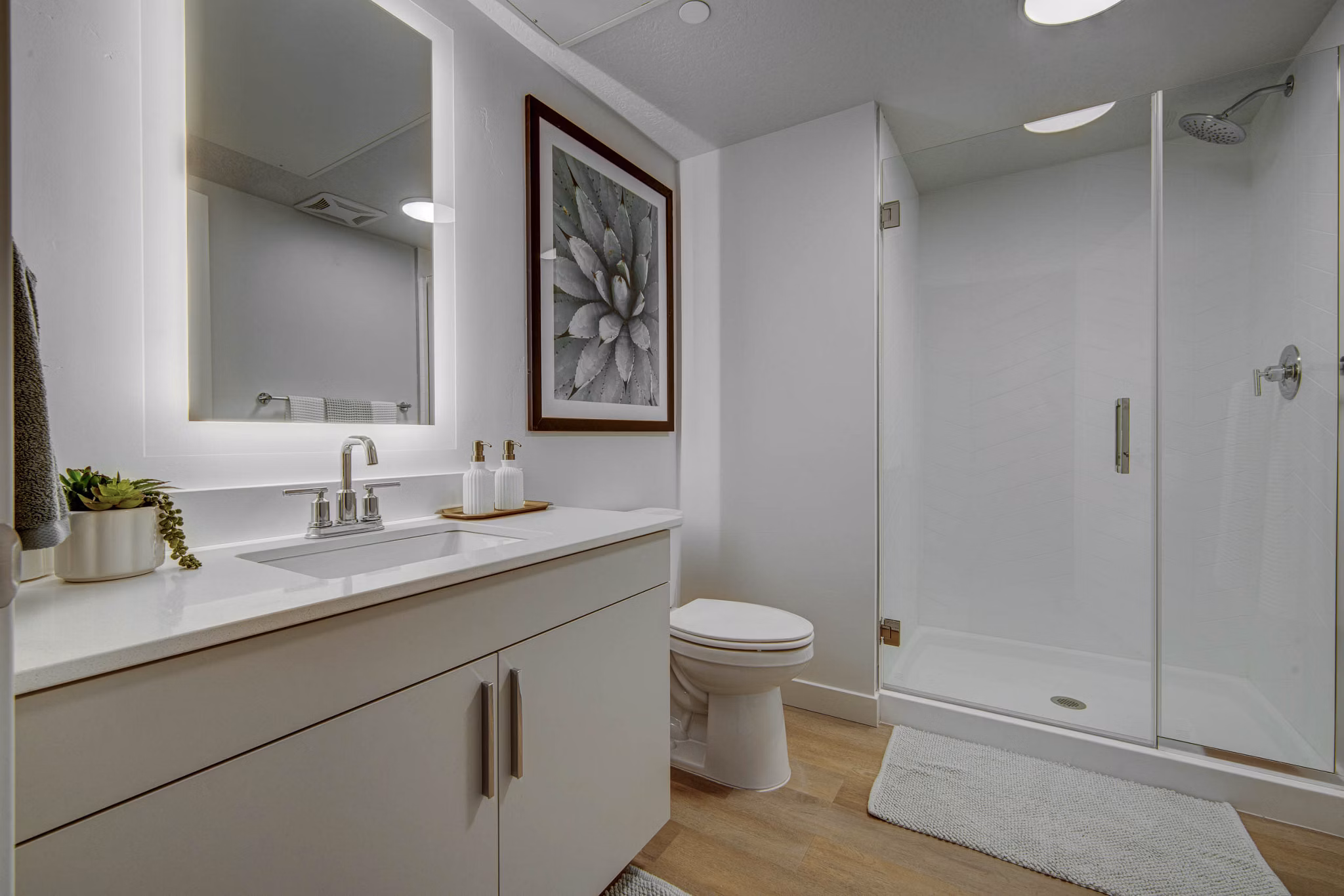 Modern bathroom with sleek fixtures at The DeWitt Apartments, luxury living by Greystar in a vibrant city setting