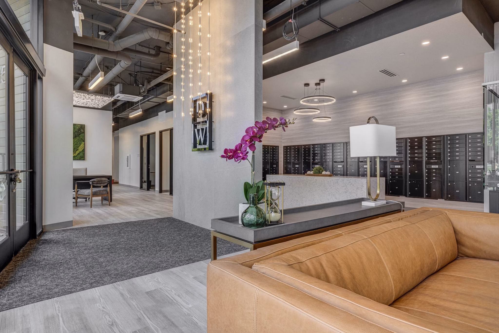 Elegant clubhouse with cozy seating and modern decor at The DeWitt Apartments