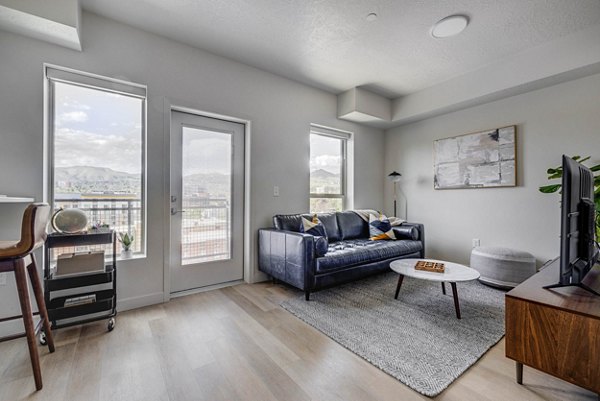 Spacious living room with modern decor at The DeWitt Apartments luxury complex