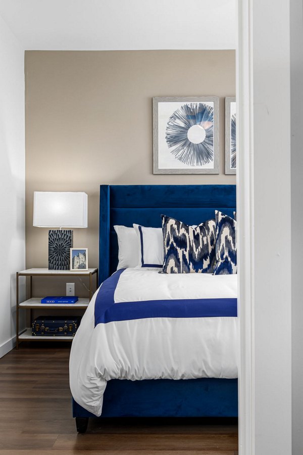 Modern bedroom with city views at The Slater Apartments