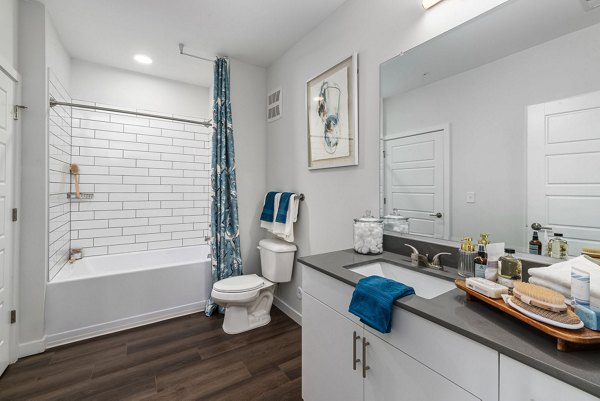 Modern bathroom with sleek fixtures and elegant design at The Slater Apartments