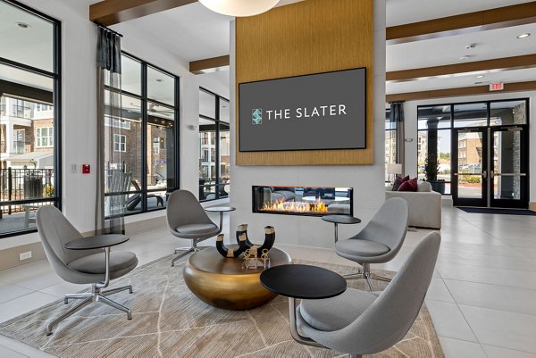 The Slater Apartments: Contemporary clubhouse with inviting seating areas and modern design in vibrant community