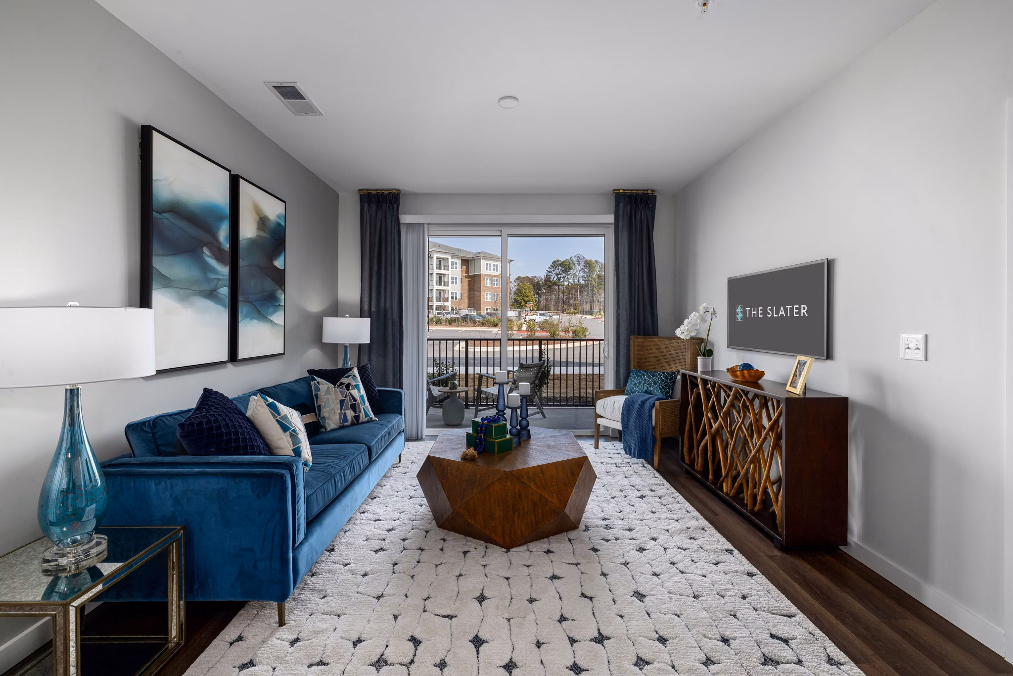 Spacious living room with stylish decor at The Slater Apartments, featuring luxury living options in urban settings