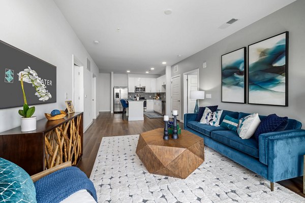 Spacious living room with modern furniture at The Slater Apartments, luxury living in the heart of the city