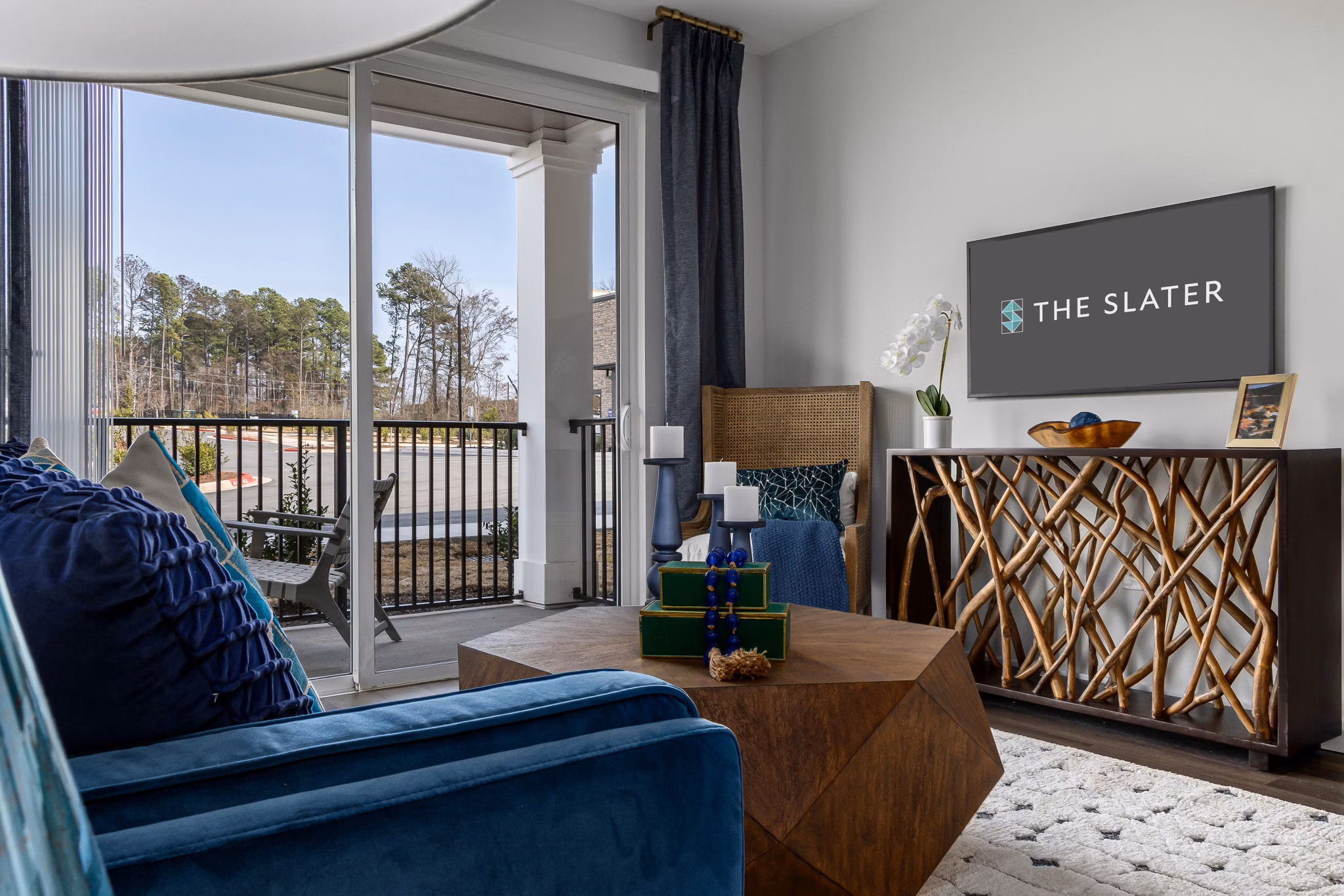 Spacious living room with modern furnishings and elegant design at The Slater Apartments