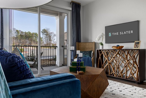 Spacious living room with modern furnishings and elegant design at The Slater Apartments