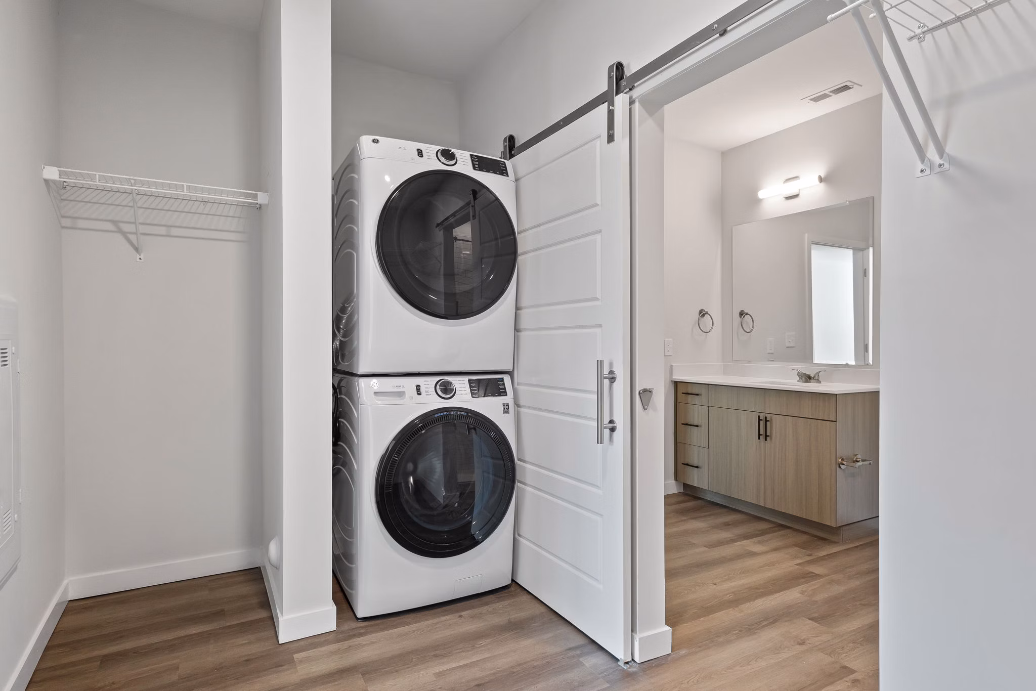 Laundry room equipped with modern appliances at The Slater Apartments