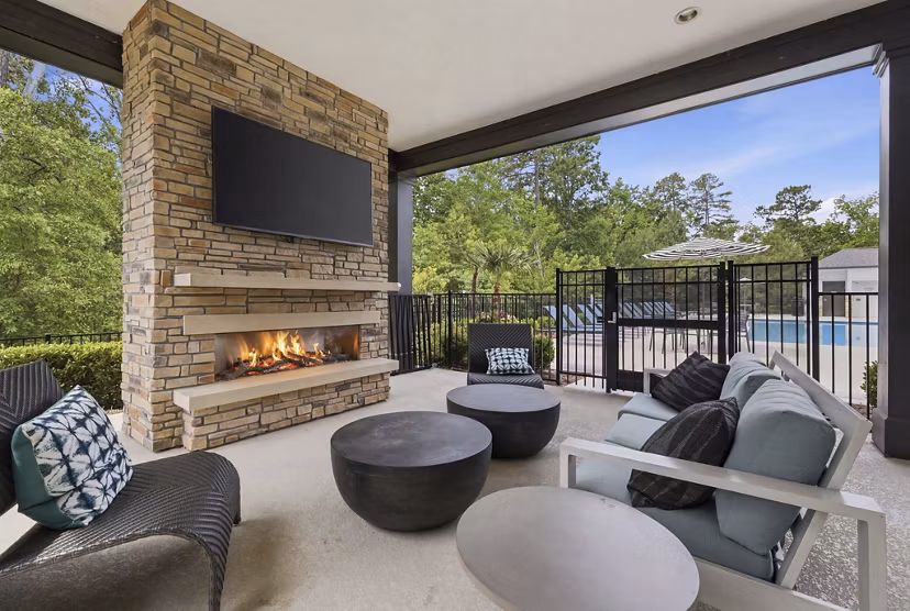 The Slater Apartments: Cozy outdoor patio with seating and greenery