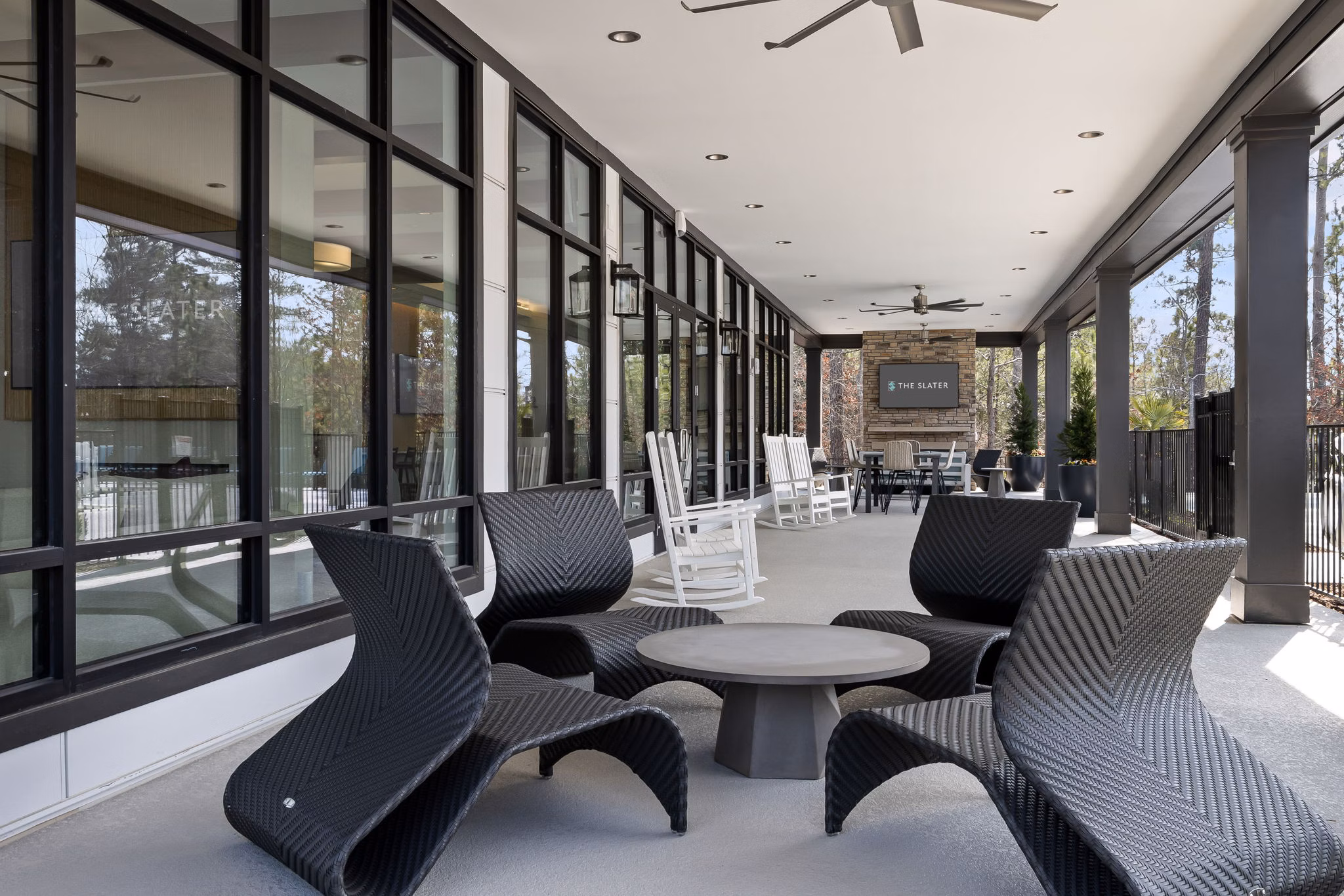 Cozy outdoor patio with modern furniture at The Slater Apartments, ideal for relaxation and social gatherings