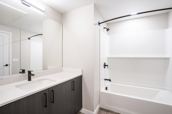 Bathroom featuring modern fixtures and stylish tiles at Sofia Apartments in Greystar's luxury community