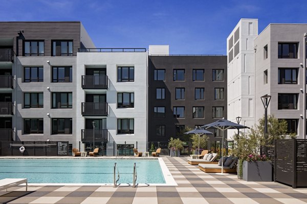 Sleek outdoor pool with cabanas at Sofia Apartments, a luxury living community