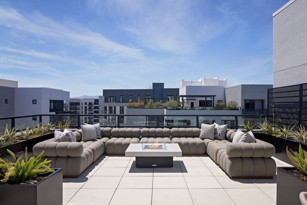 Sofia Apartments: Tranquil courtyard with landscaped gardens and seating areas in a luxury apartment community