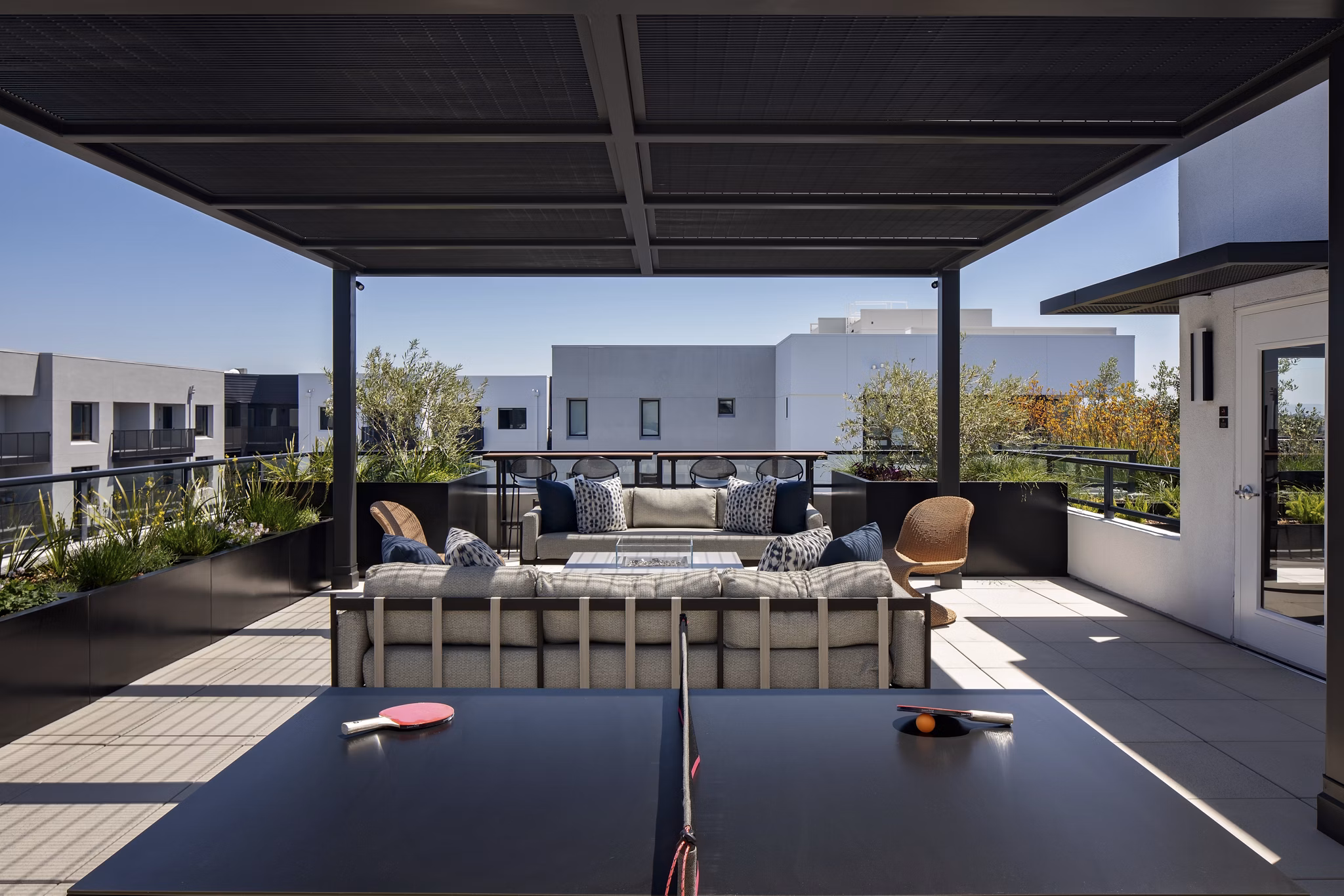 Sofia Apartments: Serene courtyard with lush greenery and seating areas in a luxury residential community