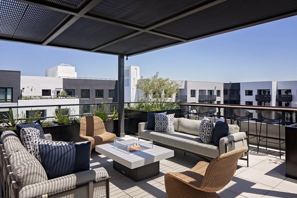 Cozy fire pit in the courtyard of Sofia Apartments, fostering community gatherings and relaxation