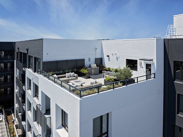 Sofia Apartments: Rooftop deck with modern seating and skyline views, offering luxury outdoor relaxation in Greystar's premium community