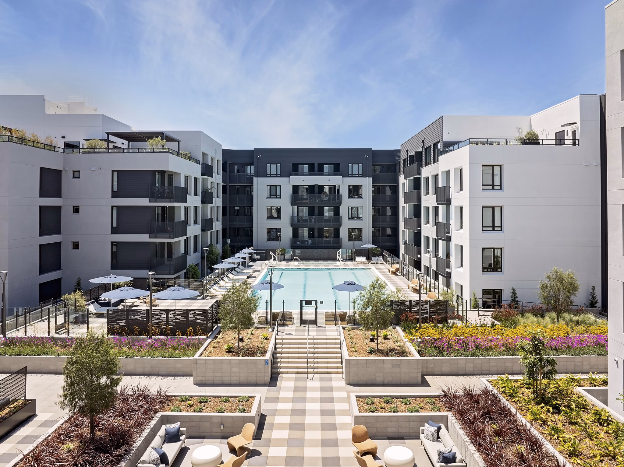 Sofia Apartments: Serene courtyard with lush landscaping and seating areas