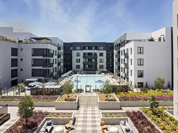 Sofia Apartments: Serene courtyard with lush landscaping and seating areas