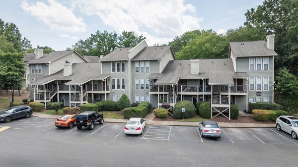 Shadowood Apartments: Elegant faÃ§ade of luxury residences nestled in a serene wooded setting