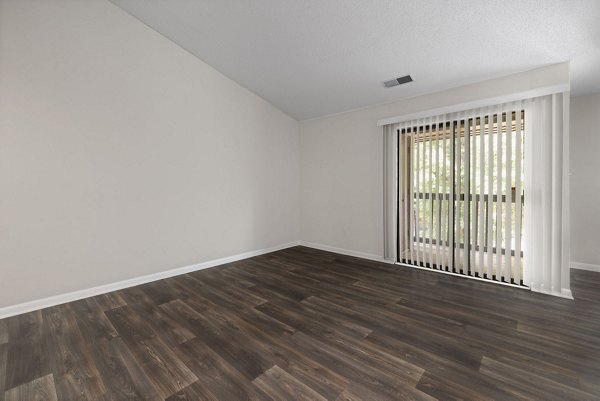 Modern living room with stylish furnishings at Sunstone Apartments: Sun-filled luxury space perfect for relaxation and entertaining