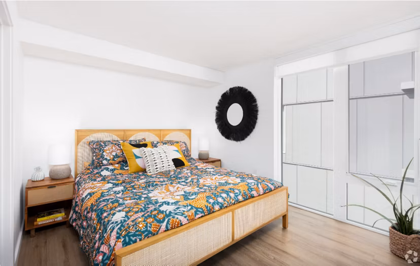 Arlo Apartments: Comfortable bedroom with sleek design and elegant furnishings in luxury apartments