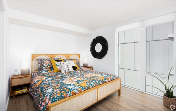 Arlo Apartments: Comfortable bedroom with sleek design and elegant furnishings in luxury apartments