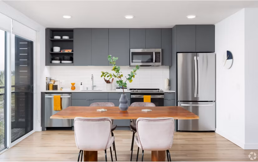 Arlo Apartments: Modern kitchen with stainless steel appliances in luxury apartment complex