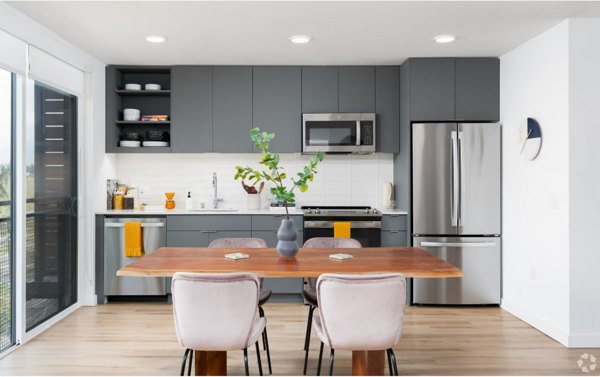 Arlo Apartments: Modern kitchen with stainless steel appliances in luxury apartment complex