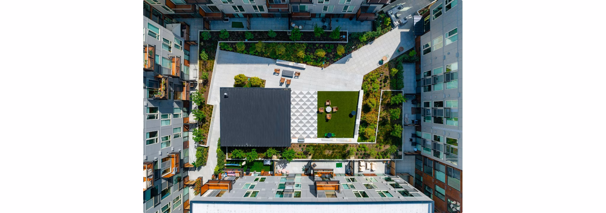 Arlo Apartments: Modern luxury apartments with sleek facade and greenery in urban setting
