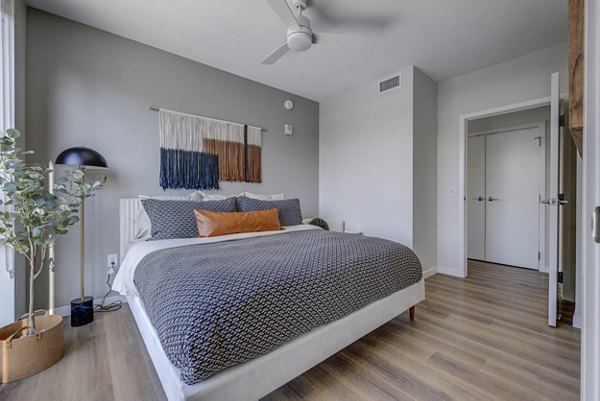 The Worthington Apartments: Modern bedroom with stylish dÃ©cor and ample natural light