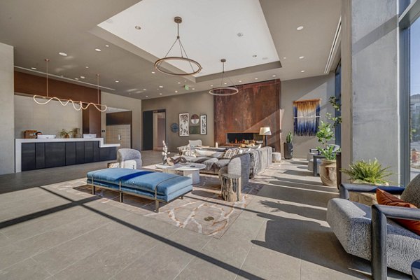 Clubhouse featuring modern design and seating areas at The Worthington Apartments in Greystar community