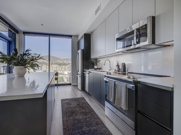 Modern kitchen with stainless steel appliances at The Worthington Apartments