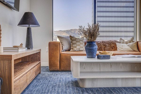 Living room with modern decor and hardwood floors in The Worthington Apartments