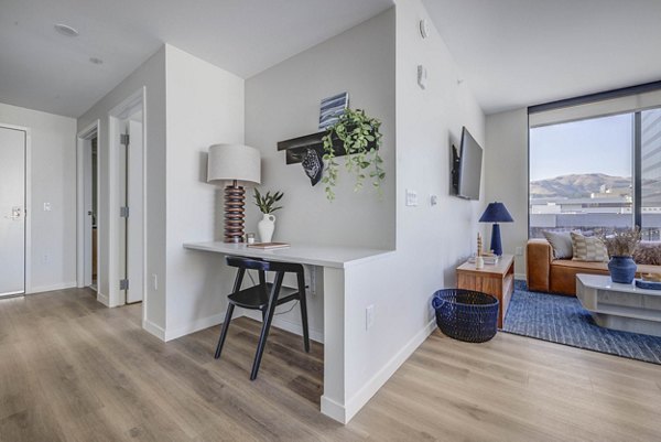 Spacious living room with modern decor at The Worthington Apartments