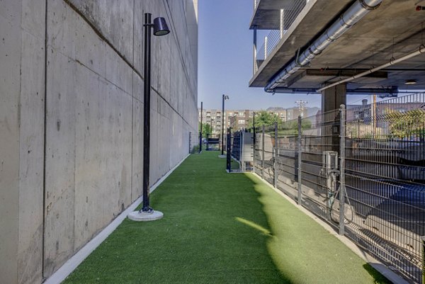 Dog-friendly park at The Worthington Apartments featuring agility equipment and open play areas for residents and their pets