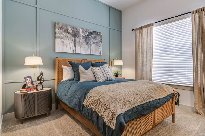 Elegant bedroom with modern decor and natural light at Solis Gainesville Apartments