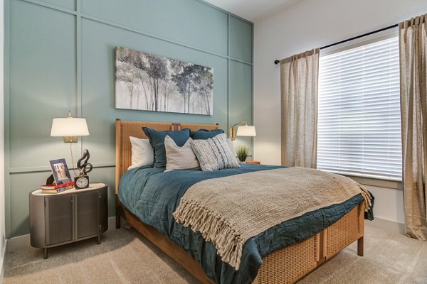 Elegant bedroom with modern decor and natural light at Solis Gainesville Apartments