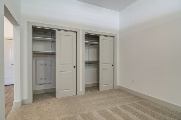 Cozy bedroom with natural light and elegant decor in Solis Gainesville Apartments